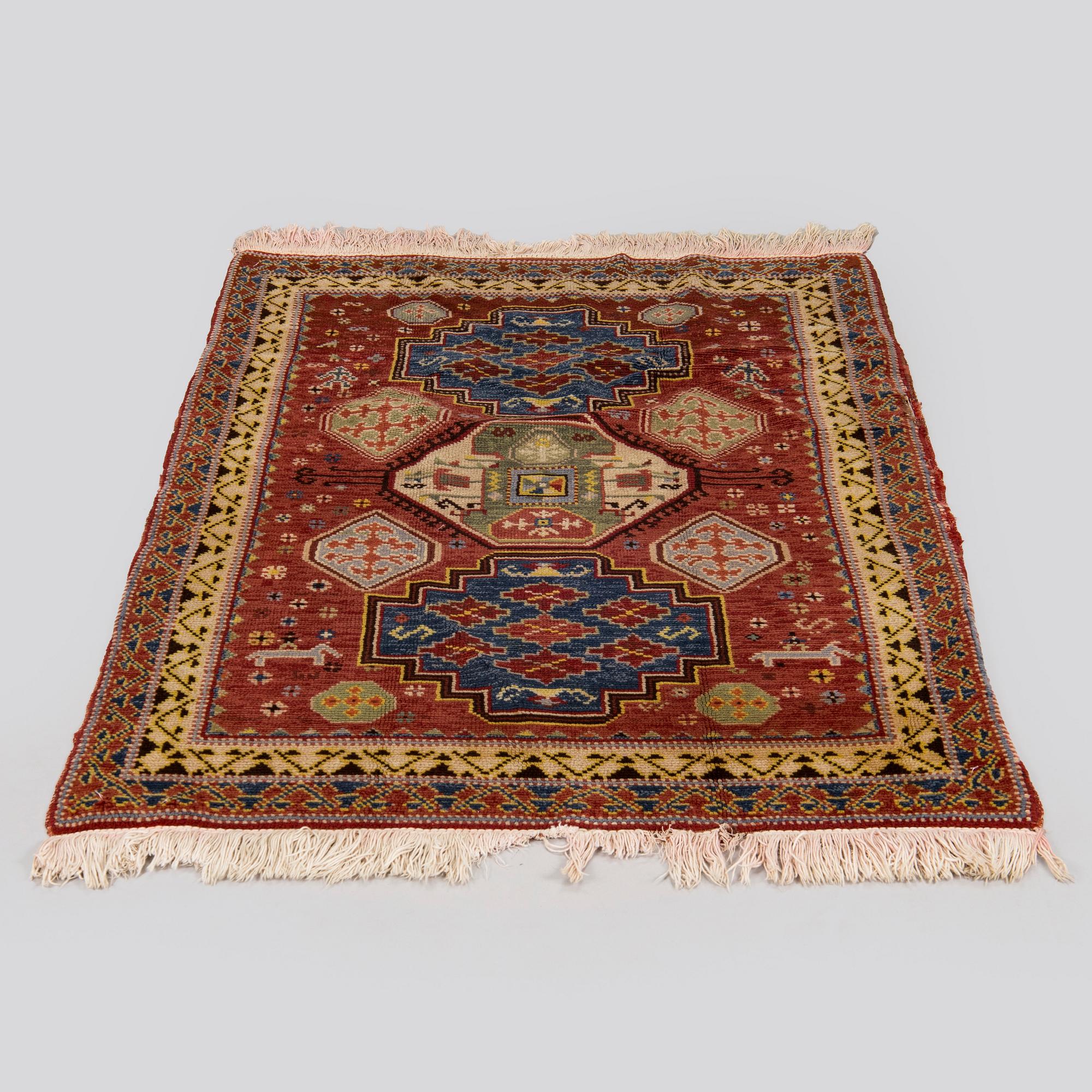 A 1940's Spanish rug Of Kazak design, ca. 139 x 93 cm.