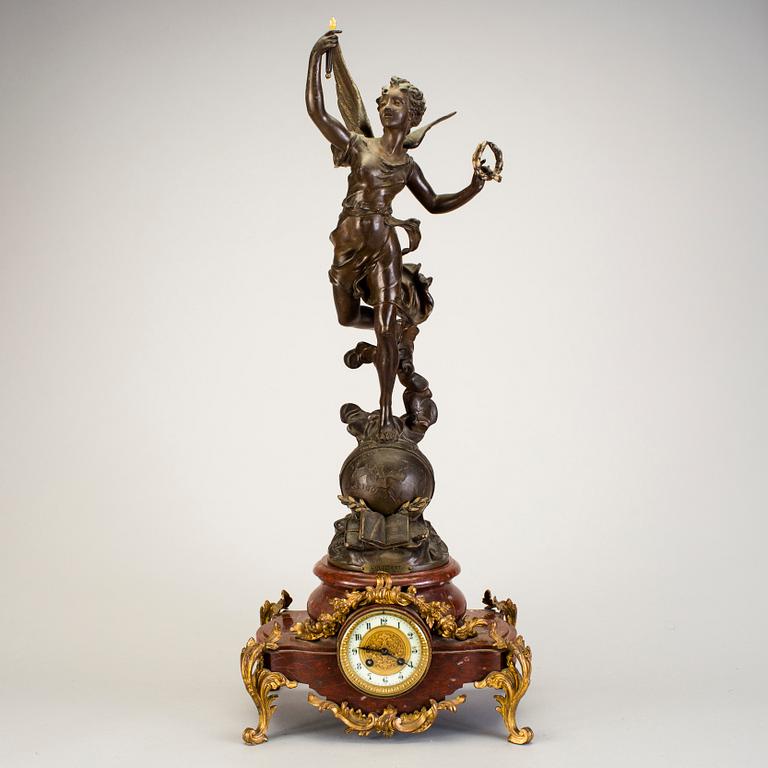A mantel clock with sculpture "L'occident" after Émile Bruchon from the turn of the century 1800/1900.