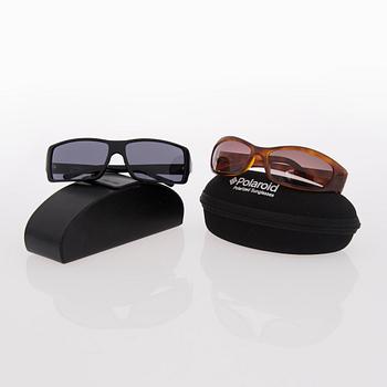 Two Pairs of Sunglasses, Prada and Chanel.