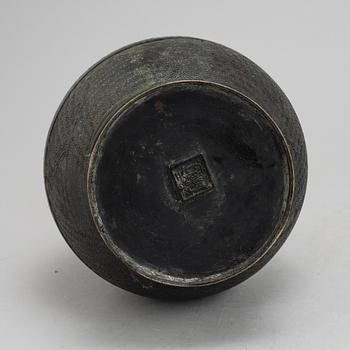 A Chinese bronze and cloisonné vase, around the year 1900.