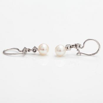 A pair of 18K white gold earrings with cutured pearls and diamonds ca. 0.24 ct in total. Westerback, Helsinki.