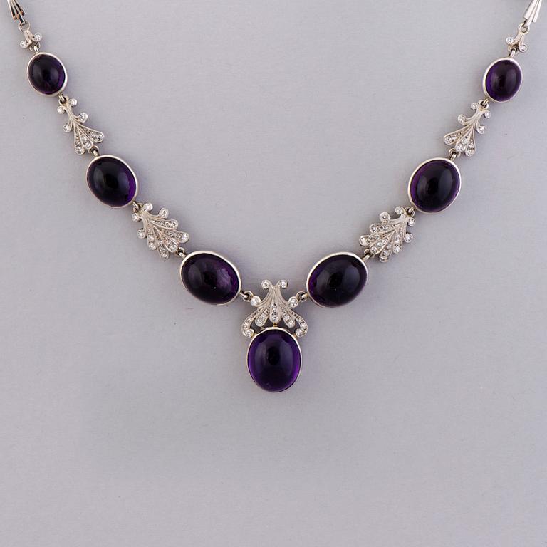 A NECKLACE, BRACELET, EARRINGS and RING, amethysts, diamnonds, 18K white gold and palladium. A. Tillander, 1970s.