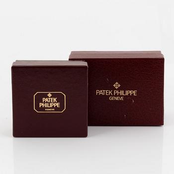 Patek Philippe, slipsnål och manschettknappar.