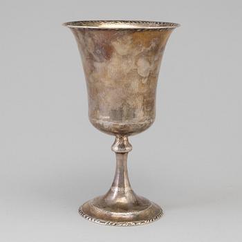 A silver cup dated 1923.