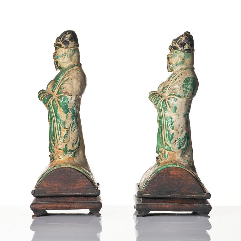 A pair of green and yellow glazed roof tiles figures, Ming dynasty (1368-1644).