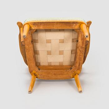 A mid-20th century armchair upholstered with fabric by Johanna Gullichsen.