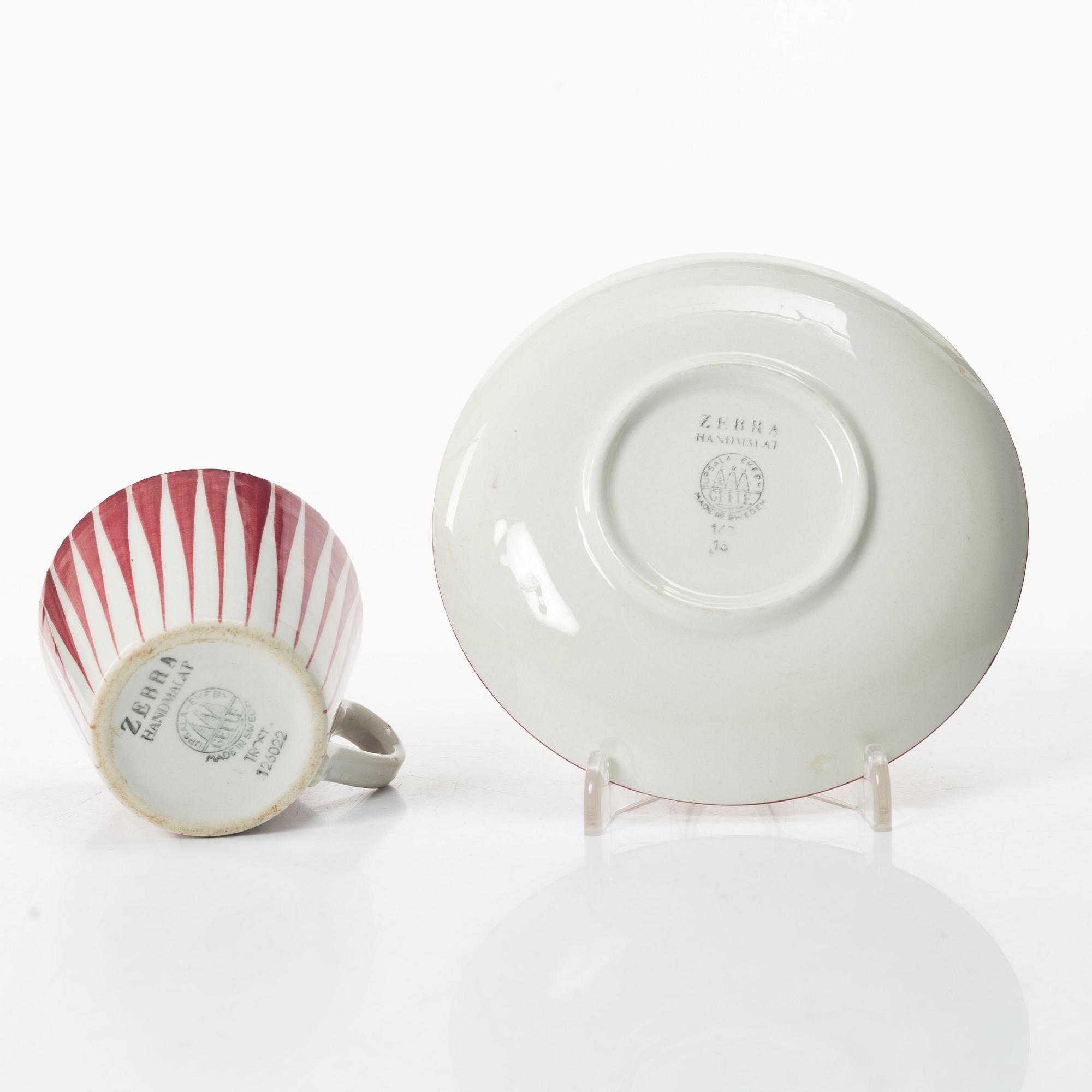 Eugen Trost, Three 'Red Zebra' cream-ware coffee cups on saucers, Uppsala-Ekeby Gefle.