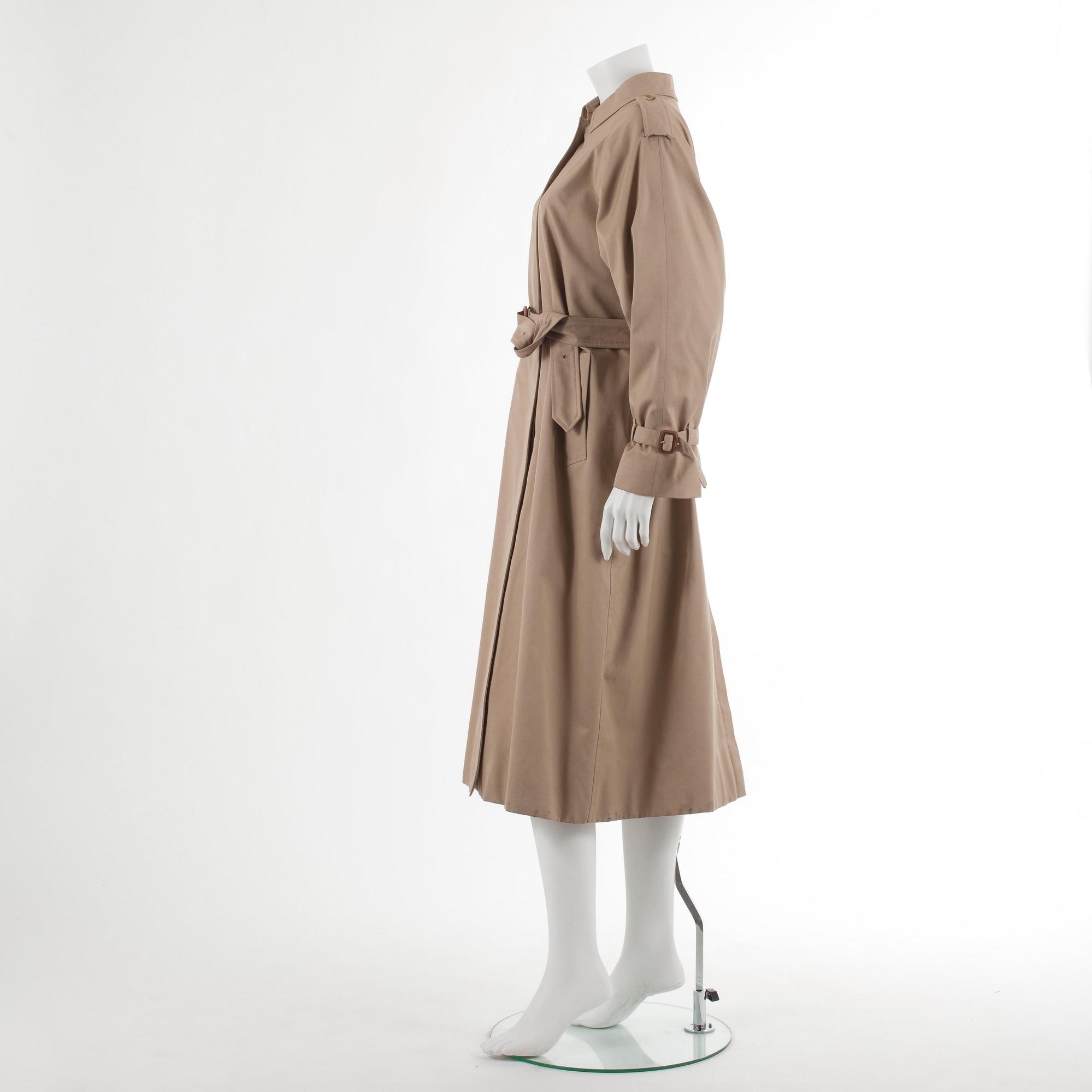 BURBERRY, a beige cotton blend trenchcoat and a shawl.