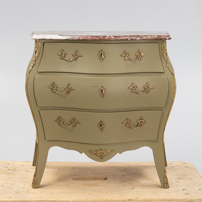 A Rococo style chest of drawers, first half of the 20th century.