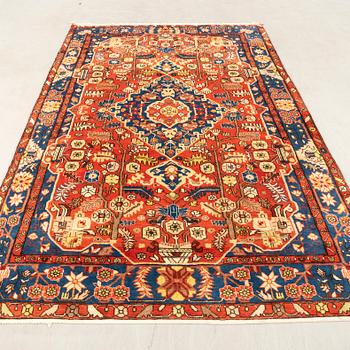 Oriental semi-antique rug, approximately 302x197 cm.