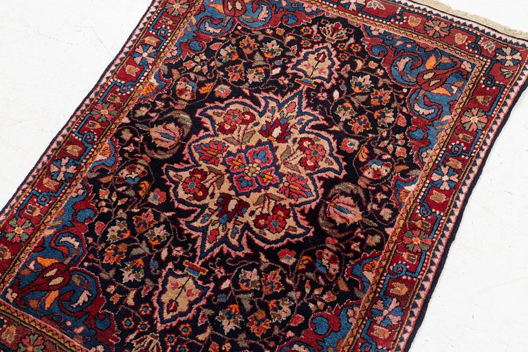 A Sarouk/Jozan rug, c. 86 x 64 cm.