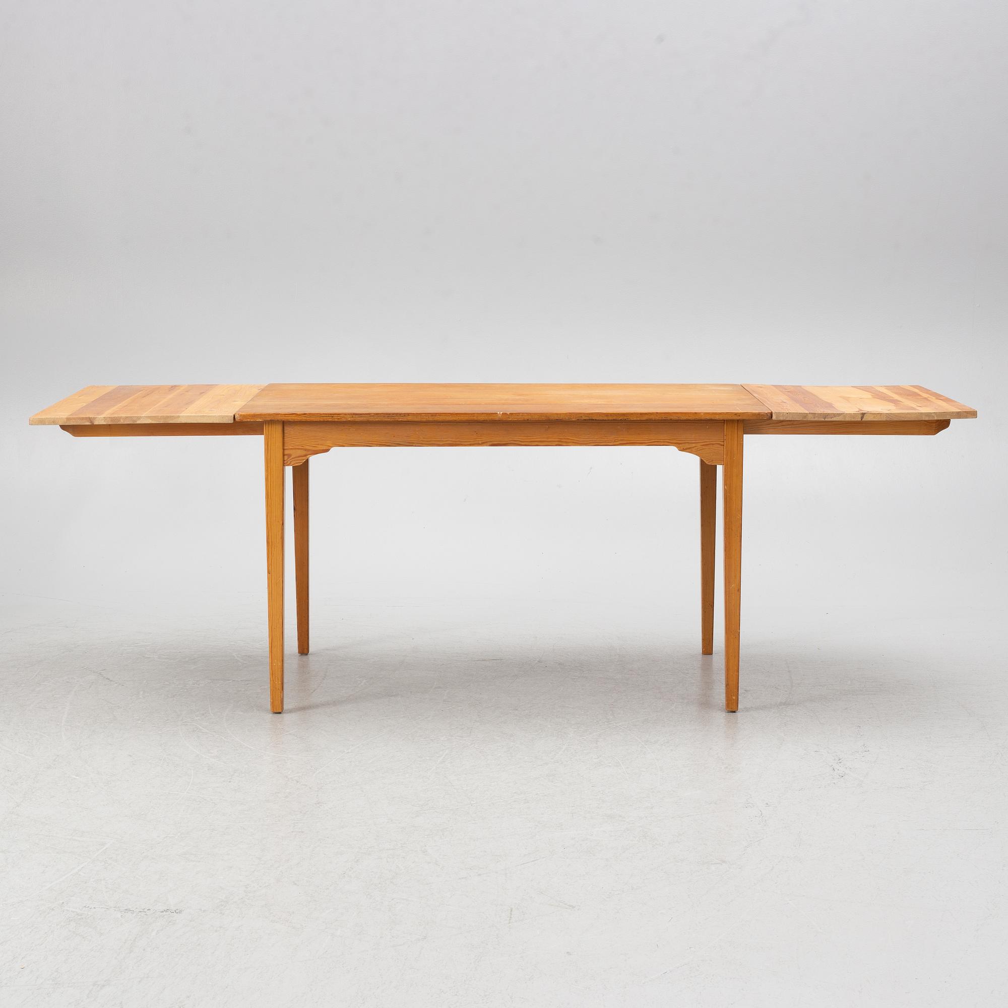 Carl Malmsten, dining table and four chairs, including Svensk Fur, second half of the 20th century.