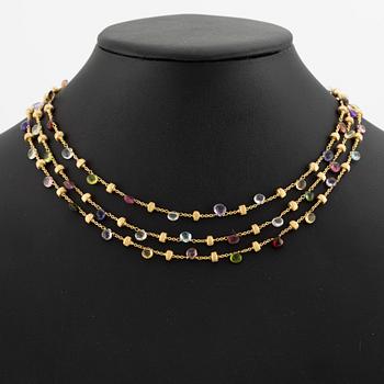 Marco Bicego a three strand necklace in 18K gold with coloured stones.