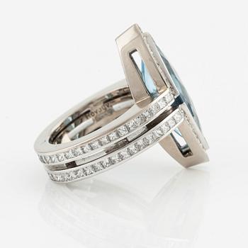 An 18K white gold Gaudy ring set with a faceted aquamarine and princess-cut diamonds.