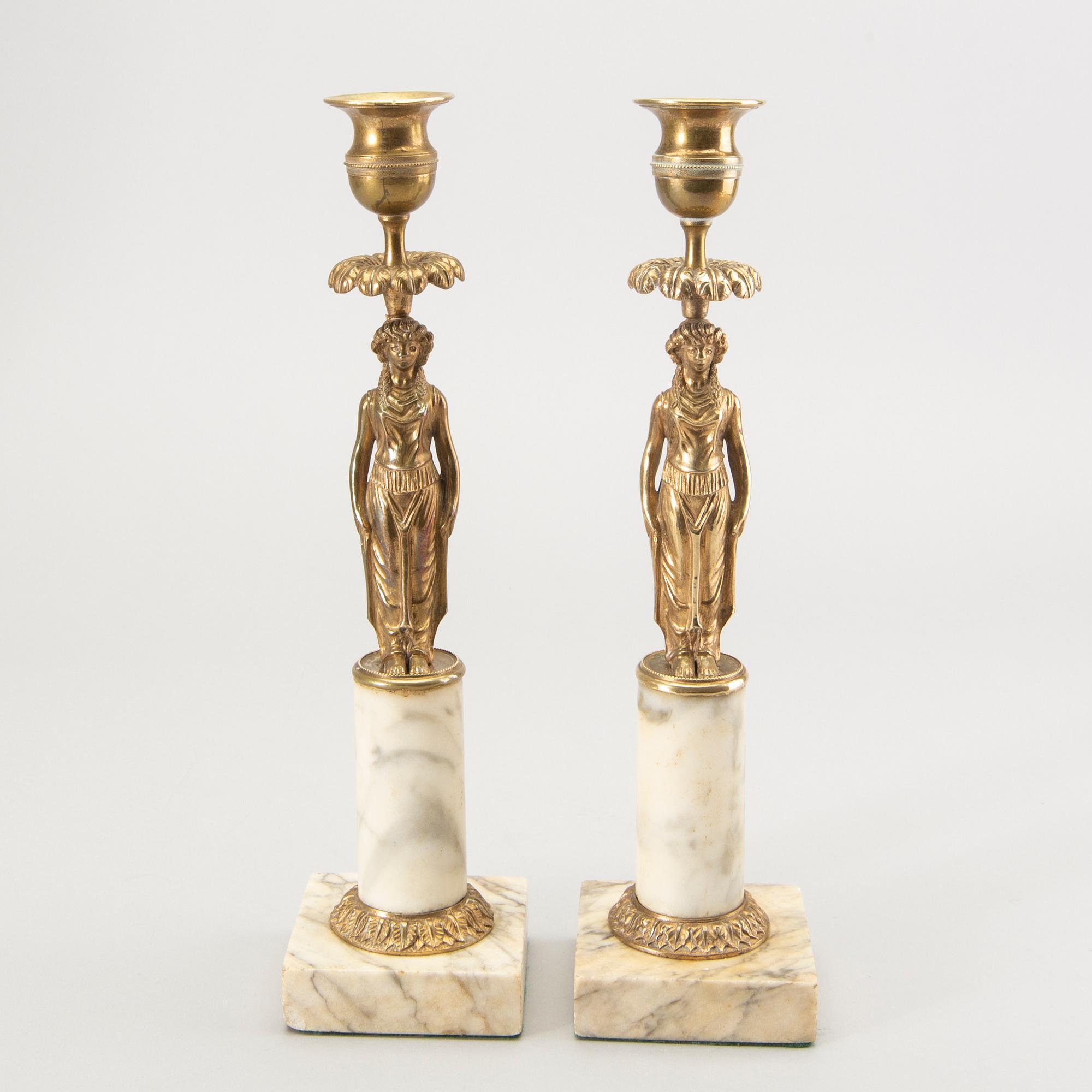 A pair of Gustavian style candle sticks around 1900.