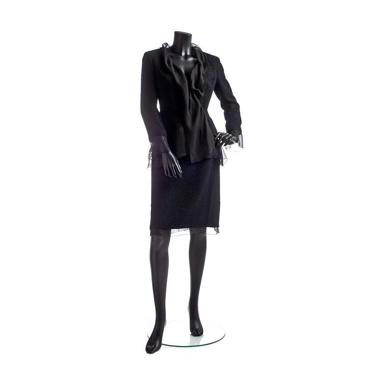 CHANEL, a two-piece suit consisting of jacket and skirt.