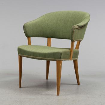 A "Lata Greven" armchair by Carl Malmsten.