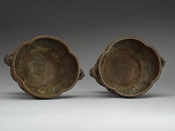 A pair of bronze flower pots, Qing dynasty, with Xuande six character mark to the interior.