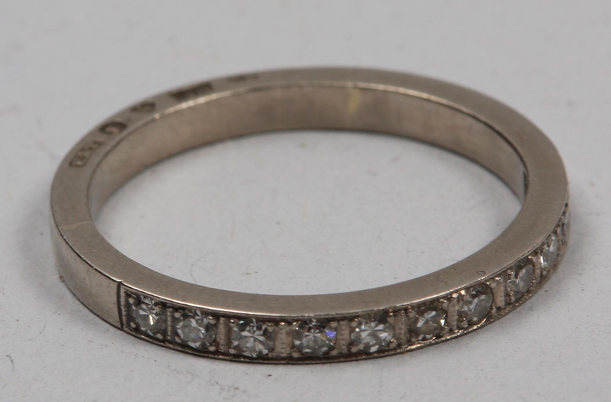 RING, 18 K vitguld och briljanter, 11 st, tot ca 0.55 ct. Erik Thomassons, Stockholm (1954? otydl stmpl).