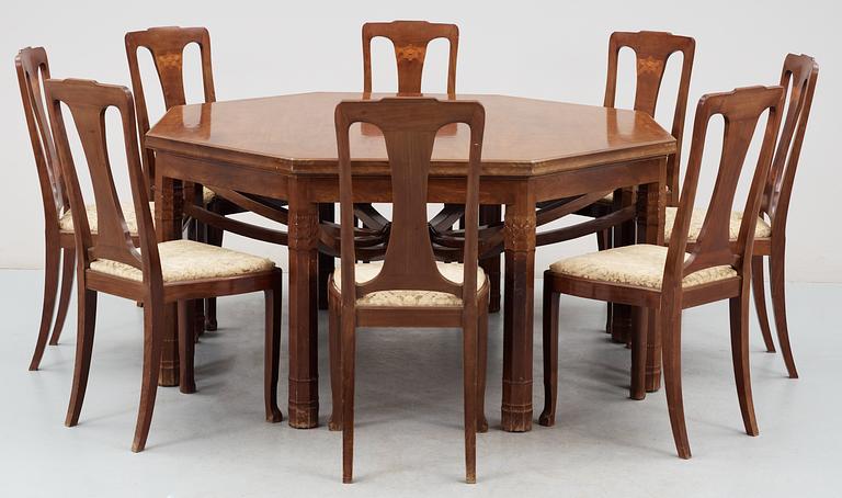 A Swedish Art Noveau mahogany dinner table with eight chairs, Kullman & Larsson, Malmö 1914.