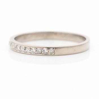 18K white gold half eternity ring with octagonal-cut diamonds.
