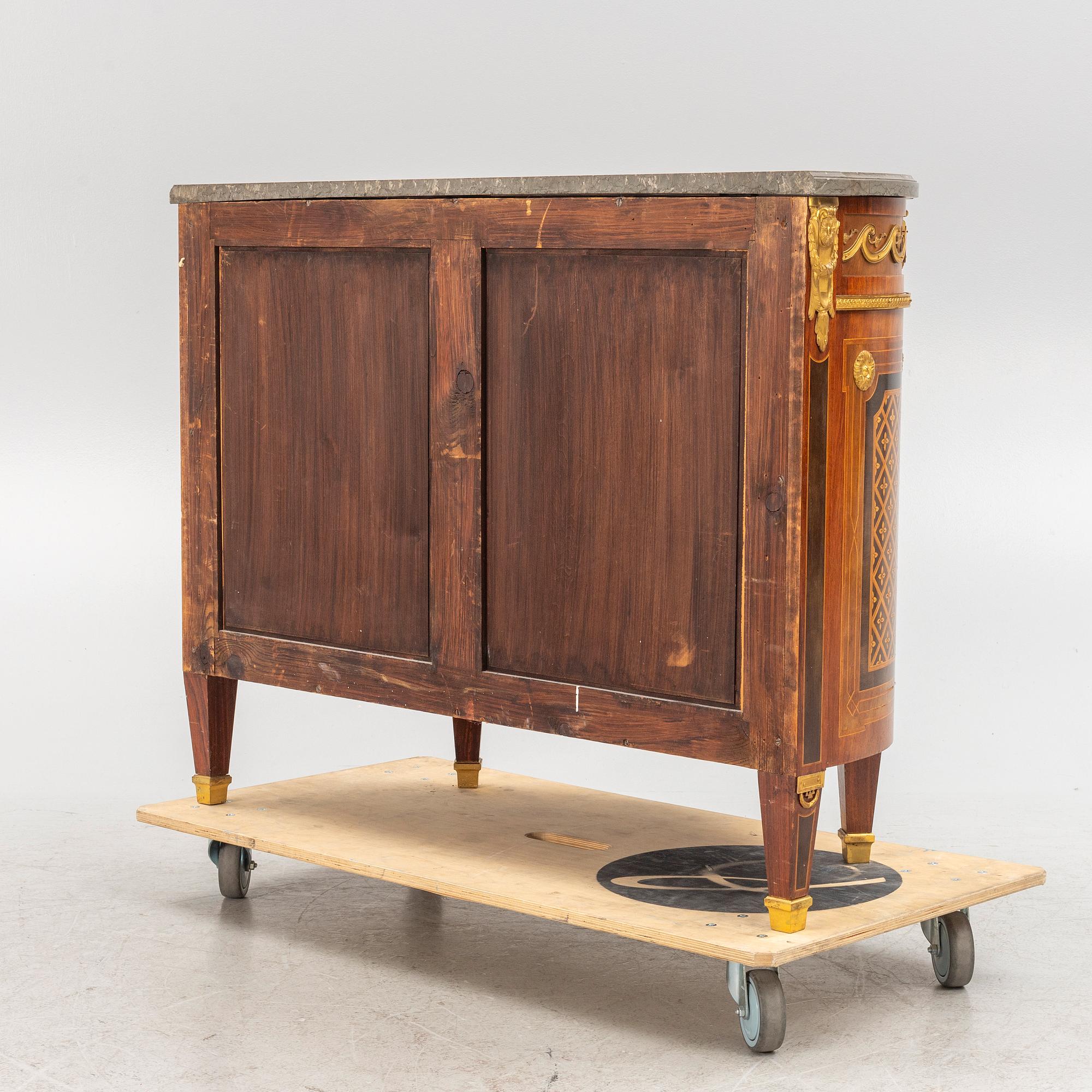 A Gustavian style cabinet with a stone top, 20th century.