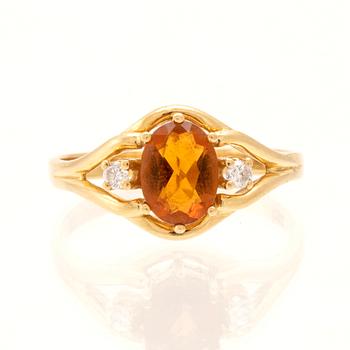 H.Stern ring in 18K gold with an oval faceted citrine and round brilliant-cut diamonds.