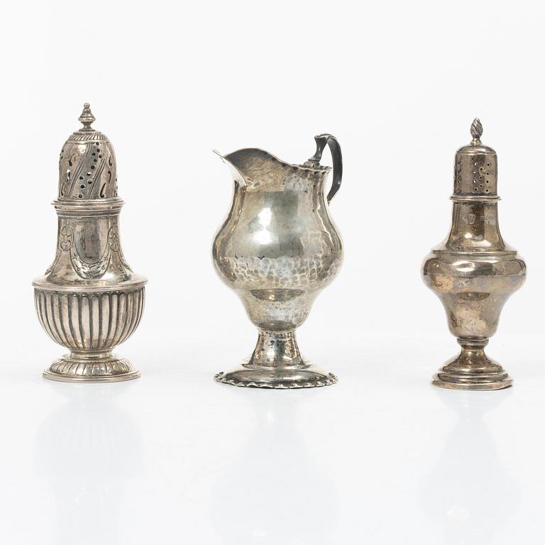 Two silver casters and cream jug, England.