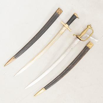 Two Swedish cutlasses 1856 pattern withs scabbards.