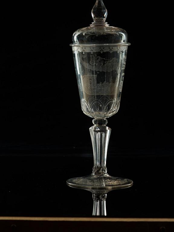 A cut and engraved glass goblet with cover, 18th Century.