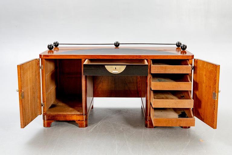 An Art Deco walnut desk.