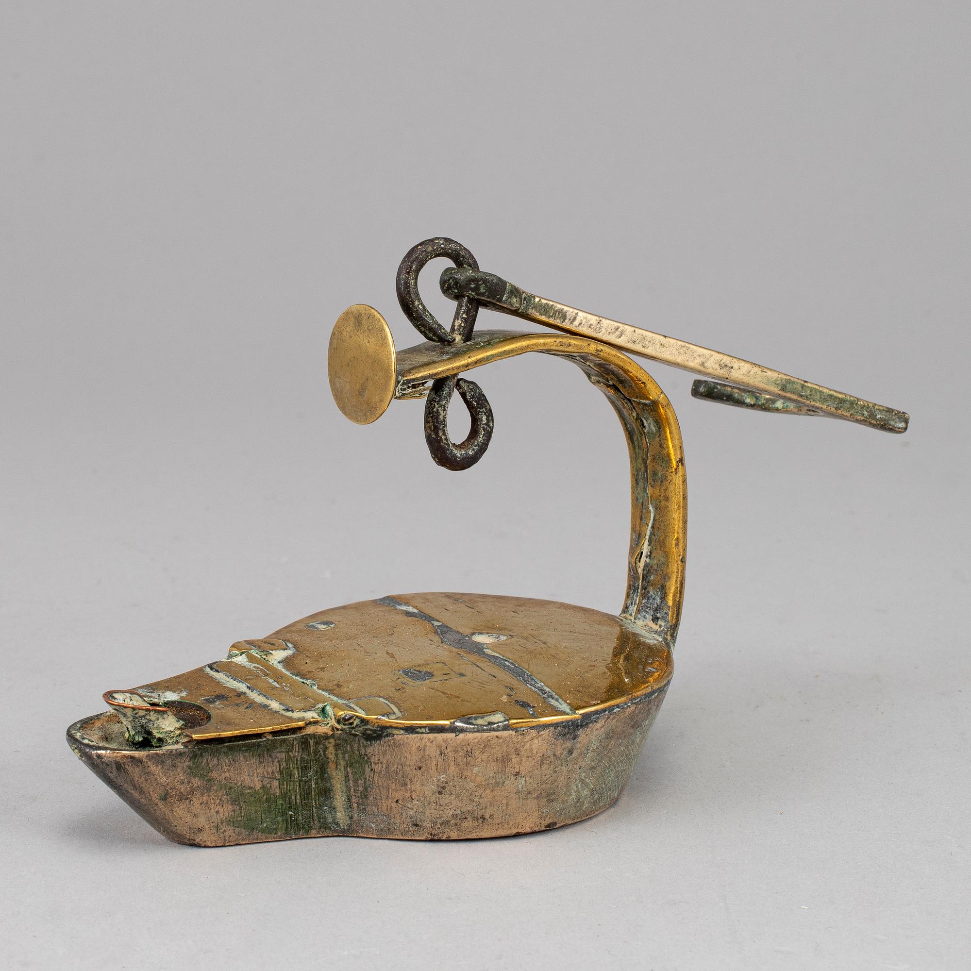 An 18th century bronze oil lamp.