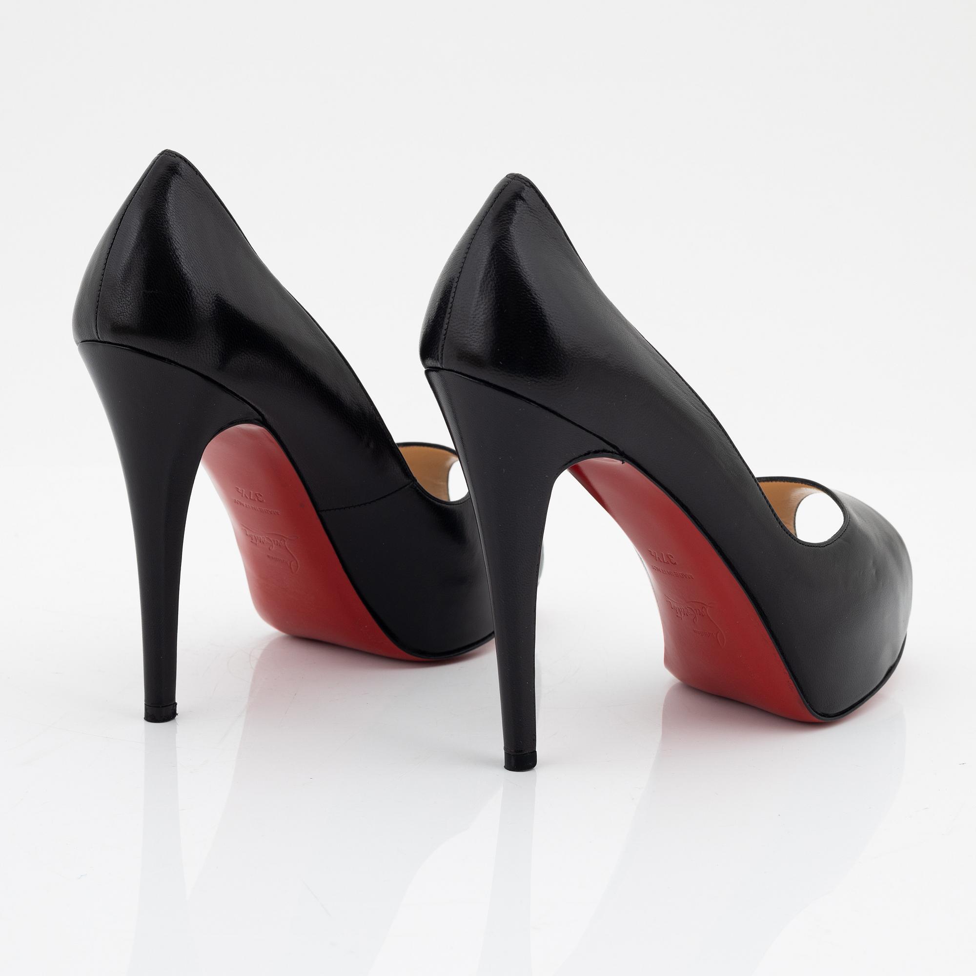 Christian Louboutin, a pair of black leather peep toe pumps, size 37 1/2.