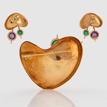 An 18K gold brooch and a pair of earrings set with quartz by Stigbert.