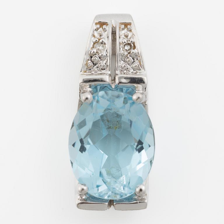 Pendant in 18K gold with a topaz and small diamonds.