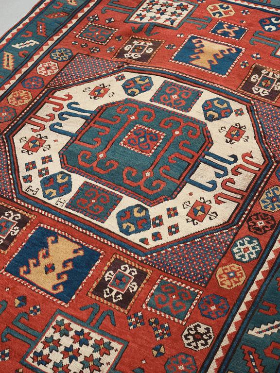 A RUG, an antique Karachop Kazak, ca 213 x 166 cm.