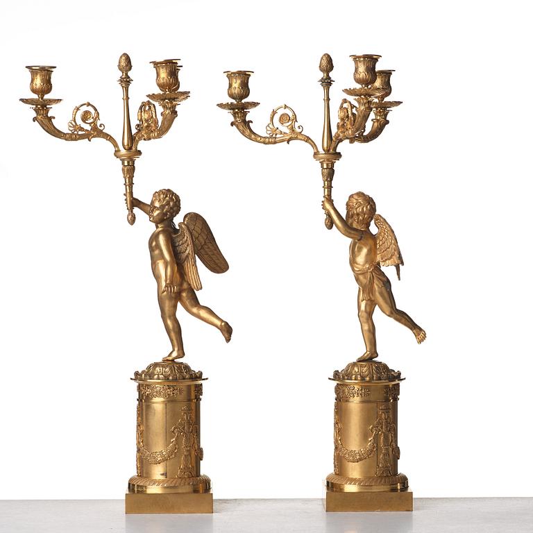 A pair of French Empire three-light candelabra, early 19th century.