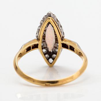 A ca. 18K gold ring with an opal and rose-cut diamonds.