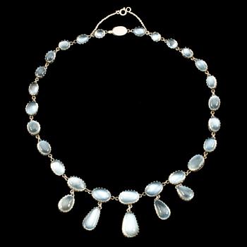 A cabochon-cut moonstone necklace. Made by C G Hallberg, Stockholm 1907.
