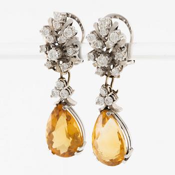 Earrings with drop-shaped citrines and brilliant-cut diamonds, probably from the 1960s.