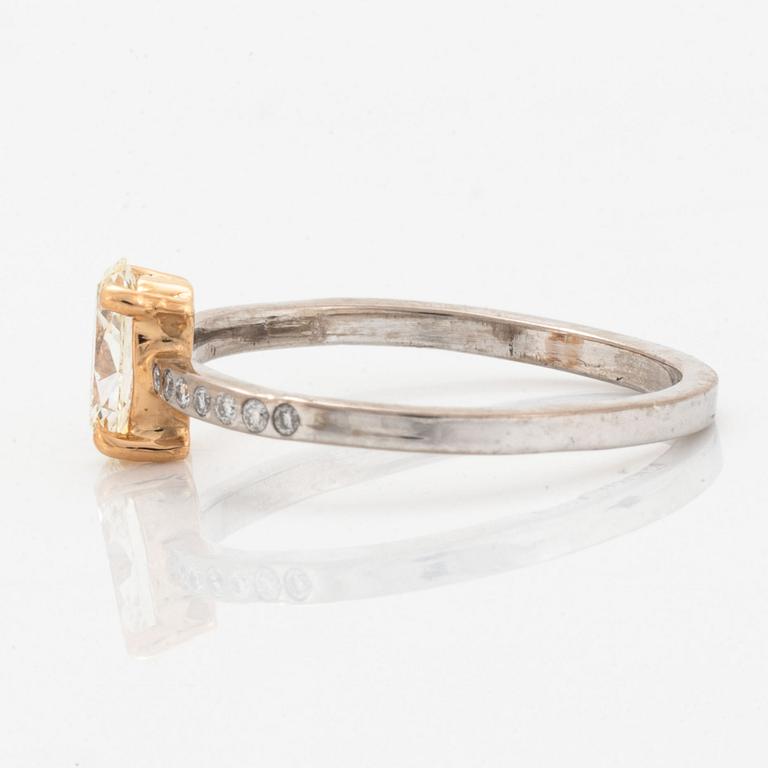 Oval diamond and brilliant-cut diamond ring.