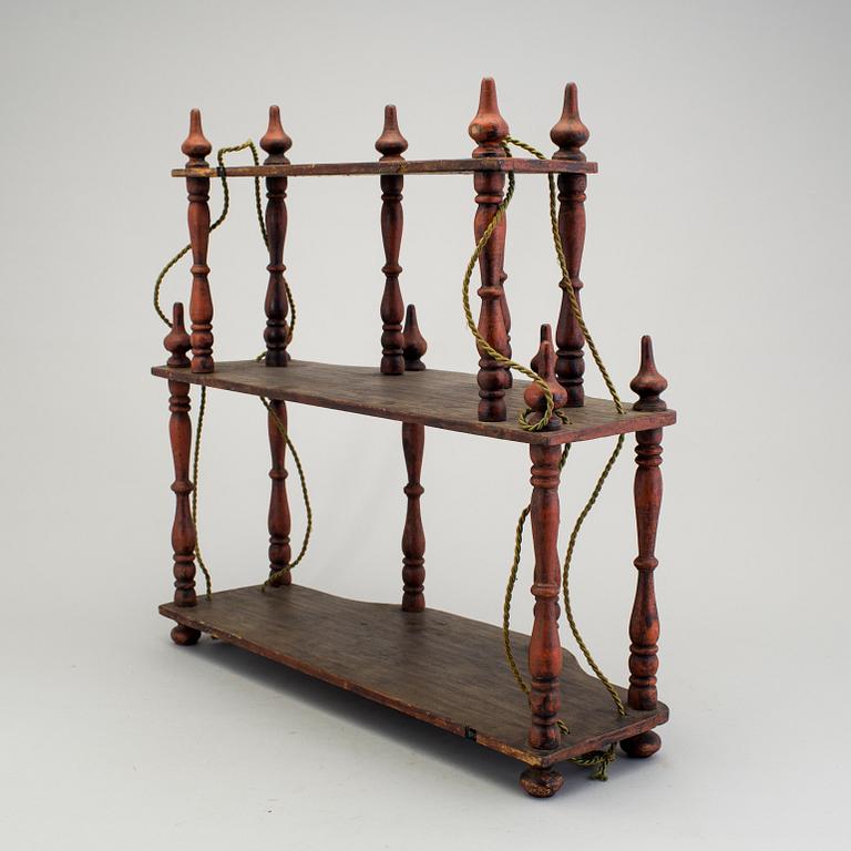 A painted folk art shelf for prayer books 19th century.