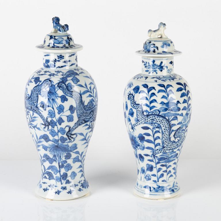 Two Chinese blue and white vases with covers, late Qing dynasty.