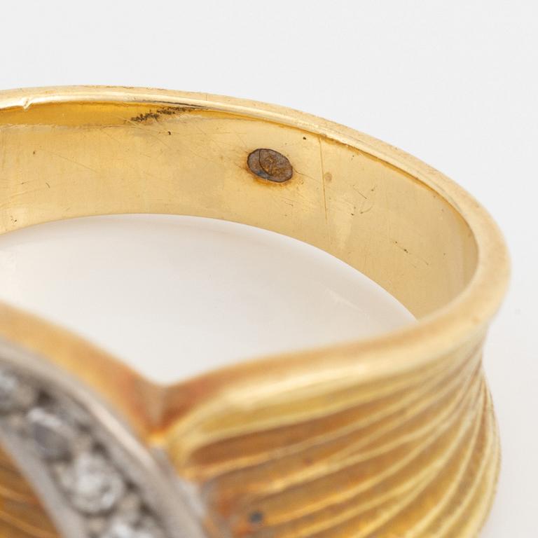 An 18K gold ring set with eight-cut diamonds.