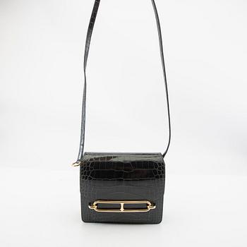 Hermès, bag "Green Shiny Alligator Mini Roulis 18 Permabrass Hardware" 2021.