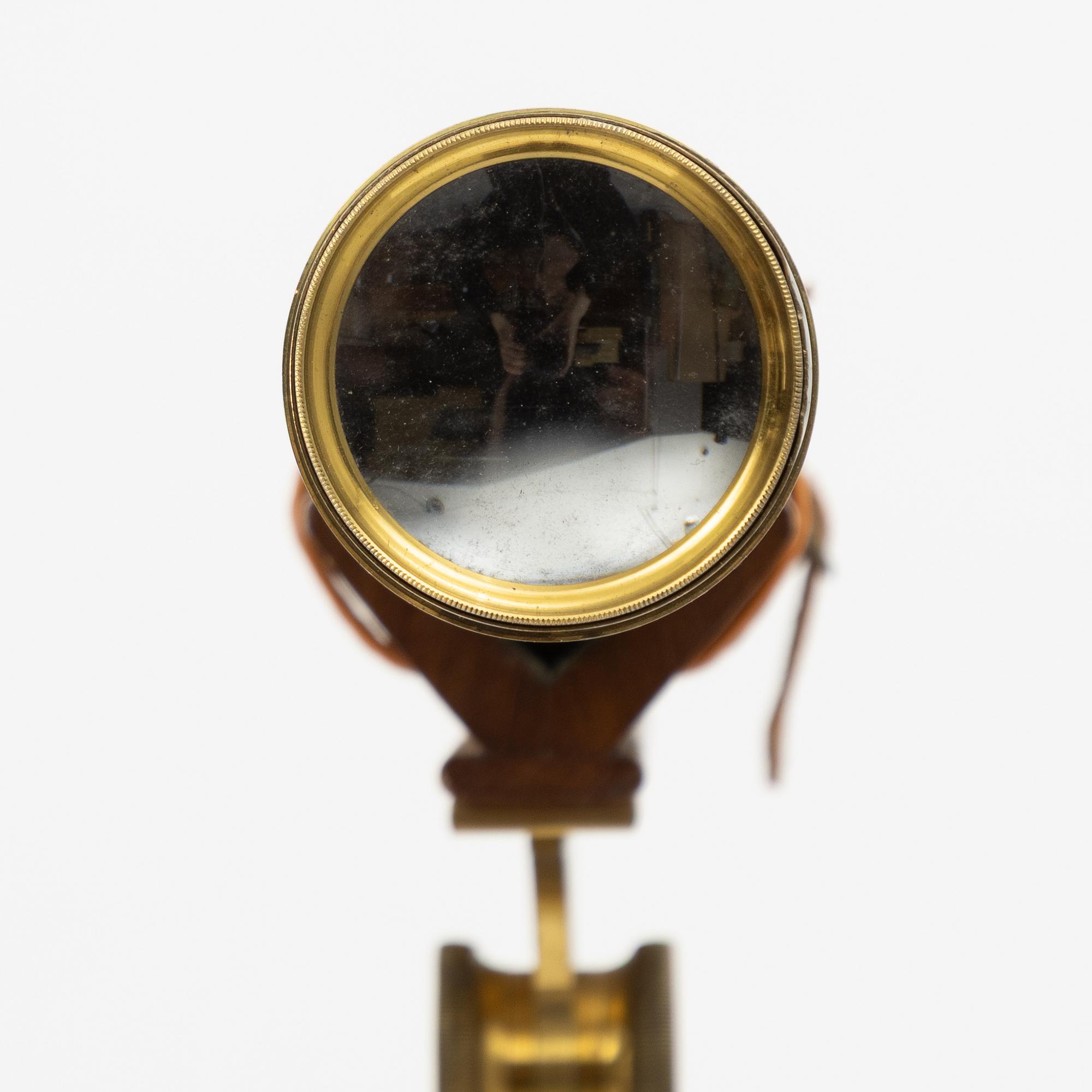 A 20th century telescope on a tripod.