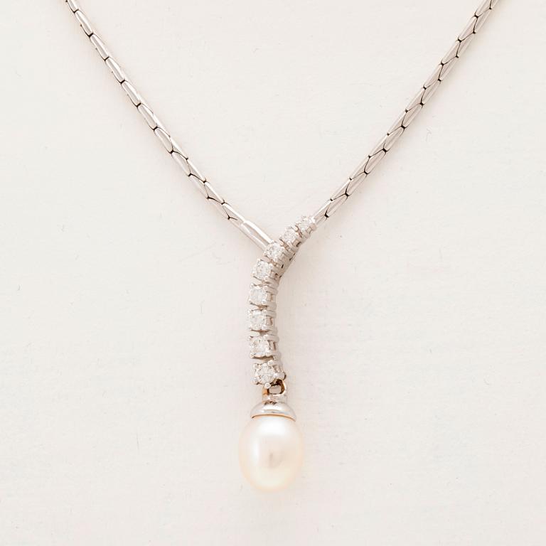 An 18K white gold necklace set with round brilliant-cut diamonds and a cultured pearl.