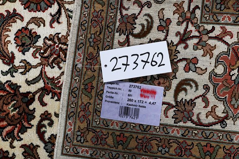A carpet, silk Kashmir, ca 260 x 172 cm.