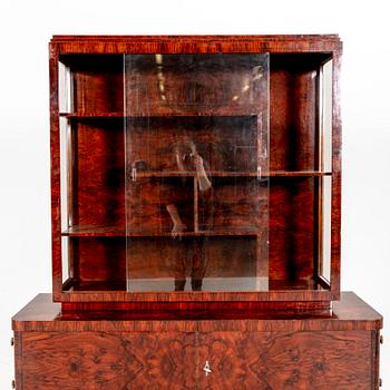 A walnut Art Deco early 1900s display cabinet.