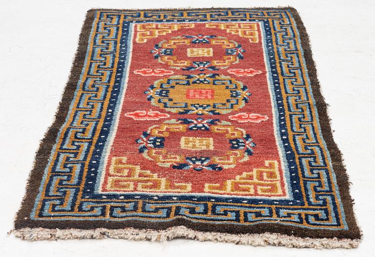 An antique Tibet 'Khaden' rug, c 135 x 70 cm.